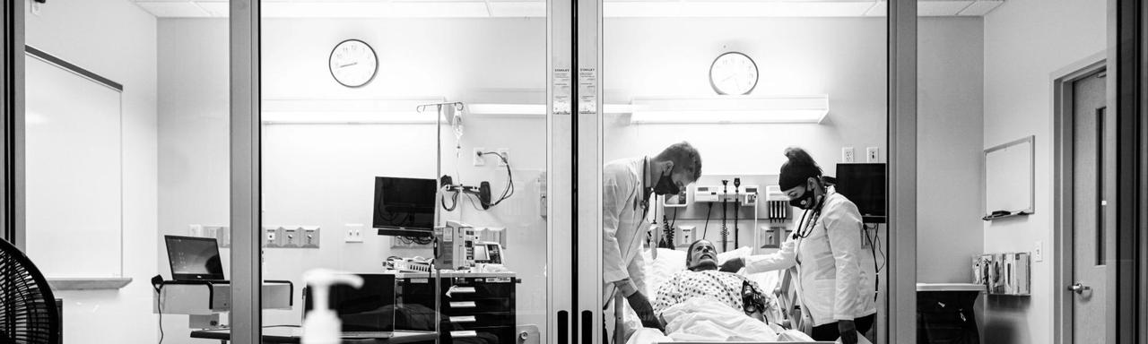 Two student with a model patient